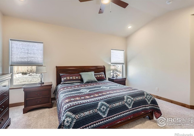 bedroom with lofted ceiling, recessed lighting, a ceiling fan, light carpet, and baseboards