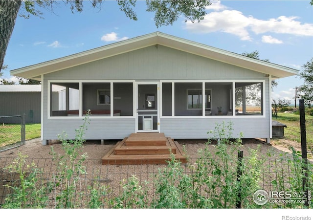 view of front facade featuring a sunroom