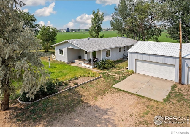 view of front of home featuring a porch, dirt driveway, metal roof, and a front yard