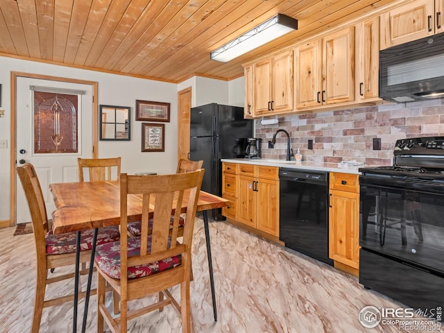 kitchen featuring a sink, wood ceiling, light countertops, black appliances, and tasteful backsplash