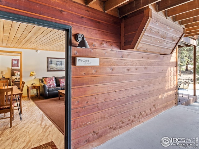 corridor with wooden ceiling and wood walls