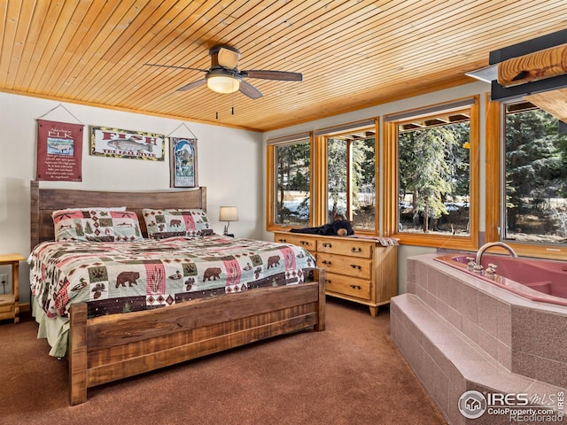 carpeted bedroom with wooden ceiling and ceiling fan