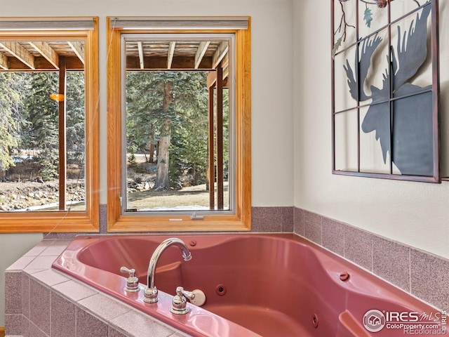 full bath featuring a tub with jets