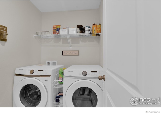 washroom featuring laundry area and independent washer and dryer