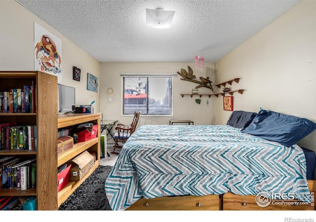 bedroom featuring a textured ceiling