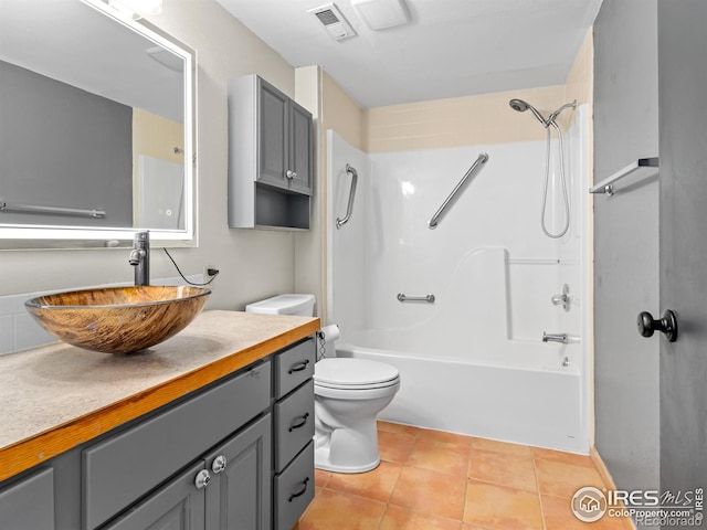 full bath featuring visible vents, toilet, vanity,  shower combination, and tile patterned flooring