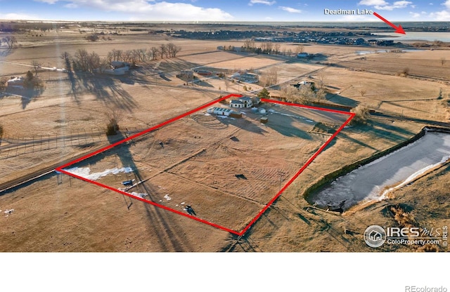 birds eye view of property featuring a rural view