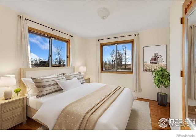 bedroom featuring wood finished floors