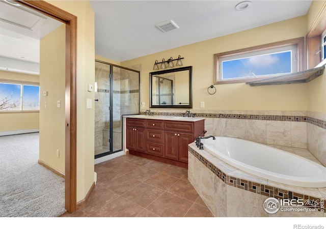 full bathroom featuring a sink, visible vents, a bath, double vanity, and a stall shower