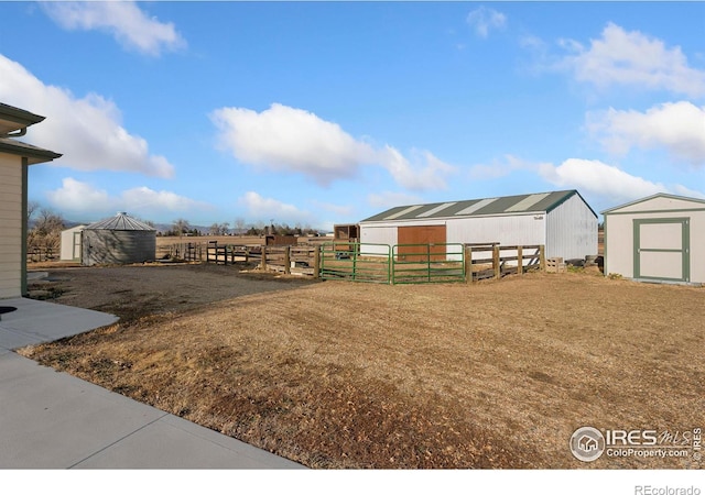 view of yard with an exterior structure and an outdoor structure