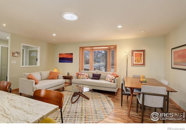 living room featuring light wood-style floors and recessed lighting