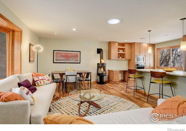 living room featuring recessed lighting and light wood-style floors