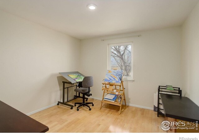 home office with baseboards, wood finished floors, and recessed lighting