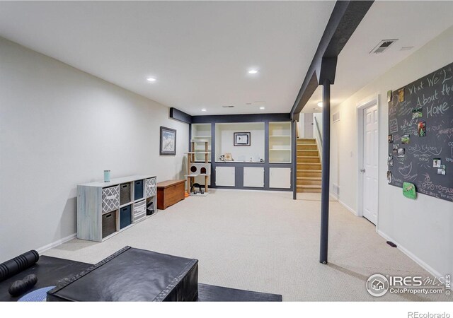 living area featuring carpet floors, recessed lighting, visible vents, stairway, and baseboards