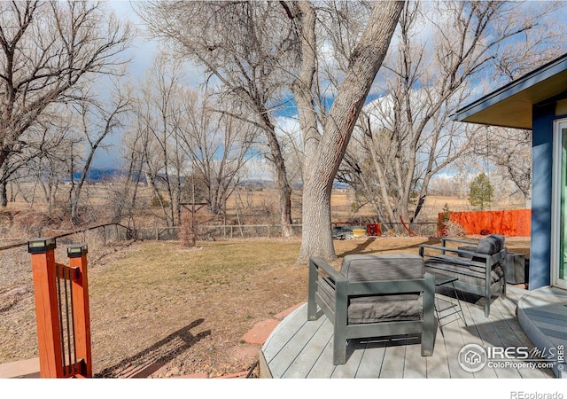 wooden terrace with a fenced backyard and a yard