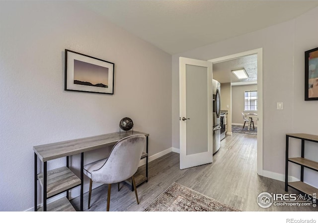 office with wood finished floors and baseboards