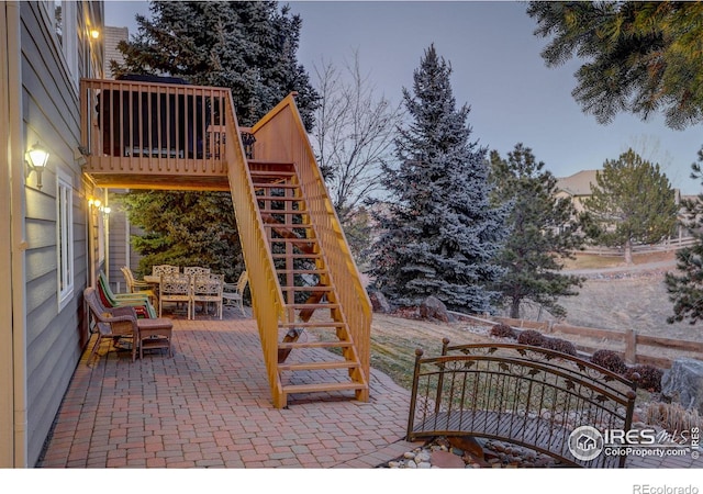 view of patio with stairs and outdoor dining space