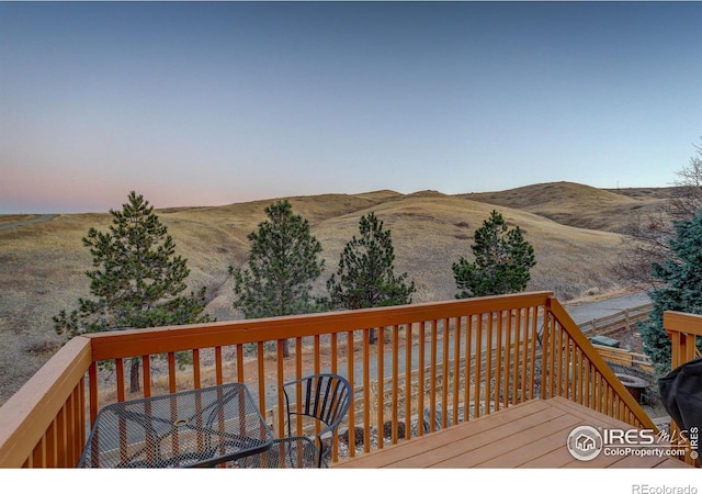 wooden deck featuring a mountain view