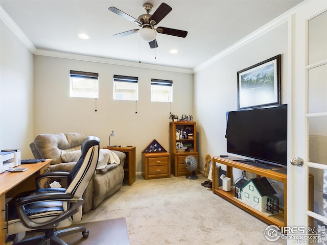 office space featuring a healthy amount of sunlight, light colored carpet, and crown molding