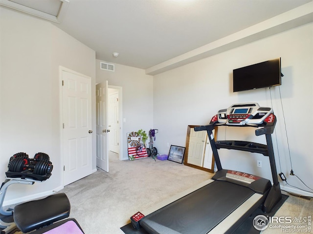 exercise room with carpet floors and visible vents