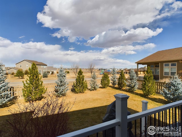 view of yard with a residential view and fence