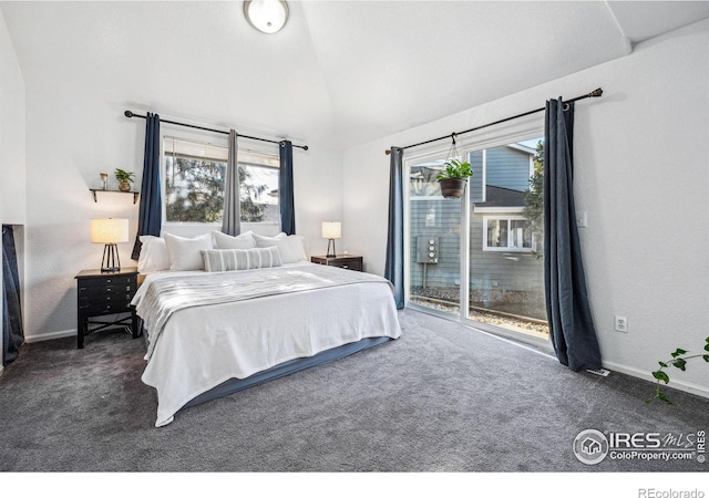 bedroom with access to exterior, dark colored carpet, vaulted ceiling, and baseboards