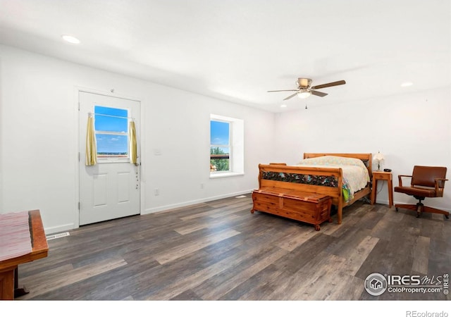 bedroom featuring dark wood-type flooring, recessed lighting, ceiling fan, and baseboards