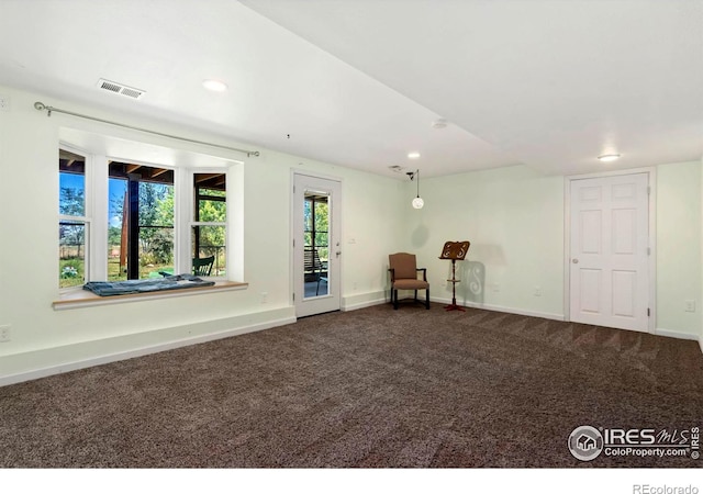 unfurnished room with recessed lighting, baseboards, visible vents, and carpet flooring