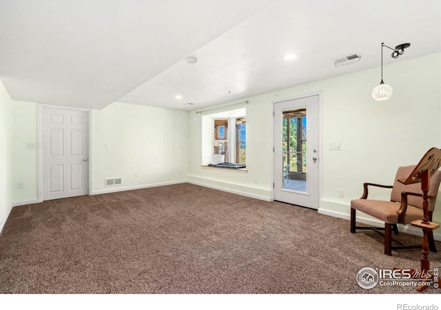 sitting room with carpet floors, recessed lighting, visible vents, and baseboards