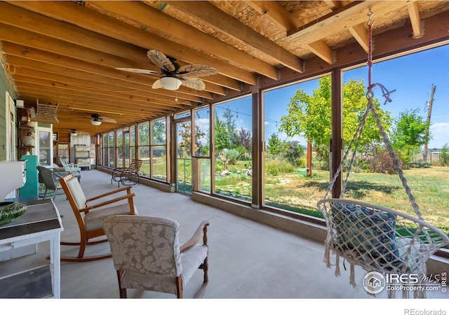 sunroom / solarium featuring ceiling fan