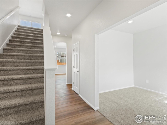 interior space featuring recessed lighting, visible vents, baseboards, and wood finished floors