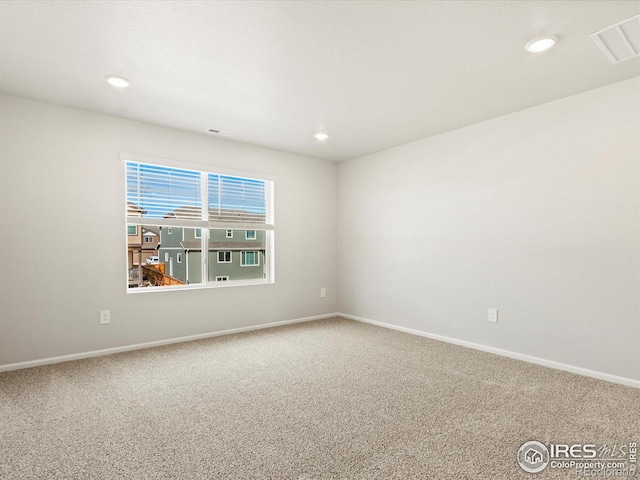 unfurnished room featuring baseboards, carpet flooring, and recessed lighting