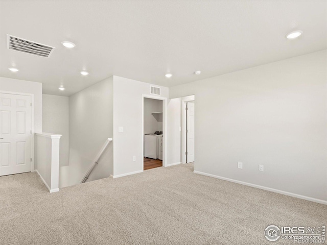 carpeted spare room with baseboards, visible vents, and recessed lighting