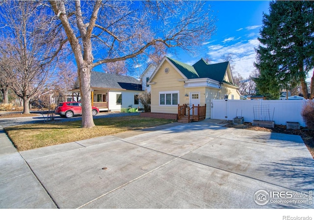 view of front of home with a gate and fence