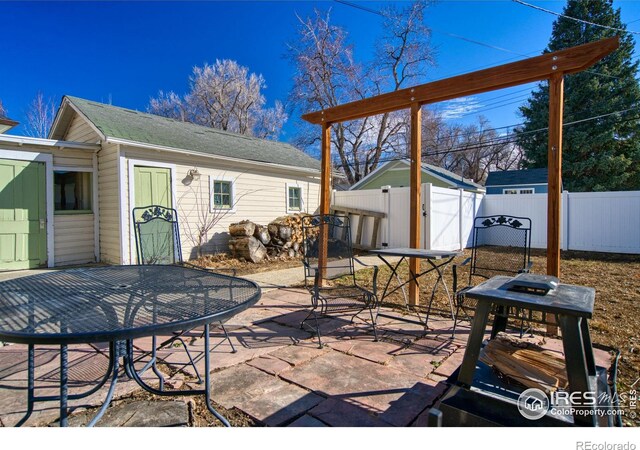 view of patio / terrace featuring outdoor dining space and fence