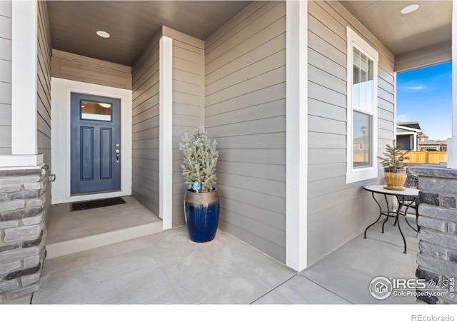 entrance to property featuring a porch