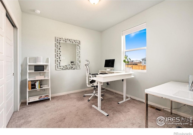 carpeted office with baseboards