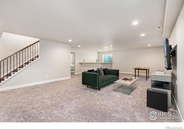 living area featuring stairs, baseboards, carpet flooring, and recessed lighting