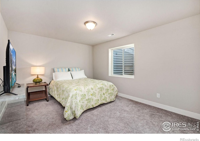 bedroom featuring carpet, visible vents, and baseboards