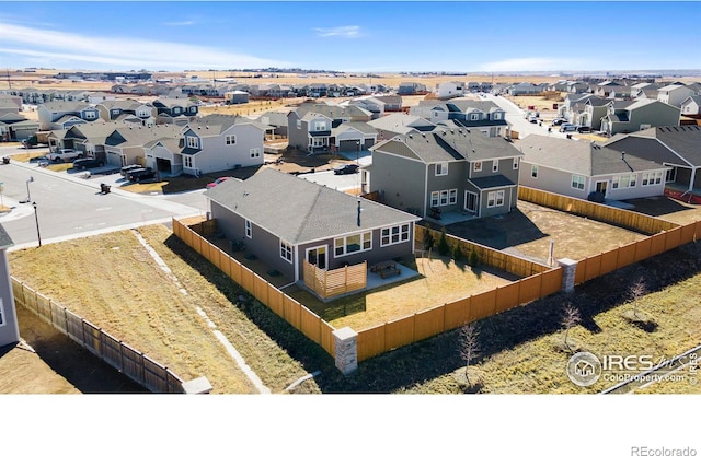 birds eye view of property with a residential view