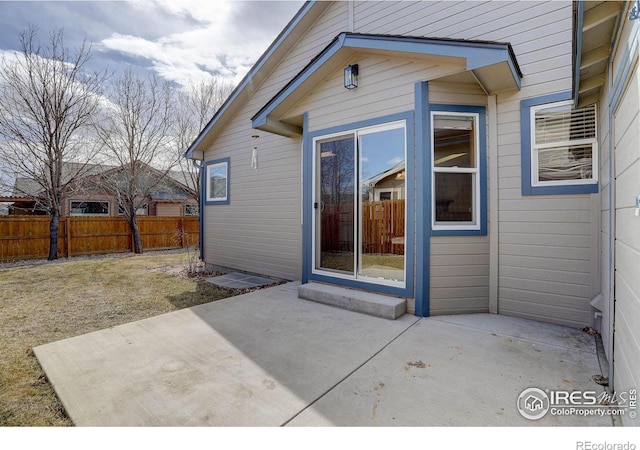 exterior space with a patio area and fence