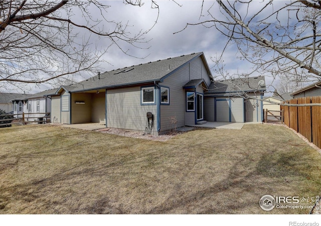 view of property exterior with a garage, a yard, fence, and driveway