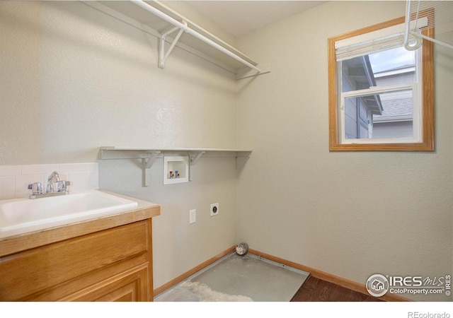 laundry area featuring a sink, laundry area, washer hookup, and hookup for an electric dryer