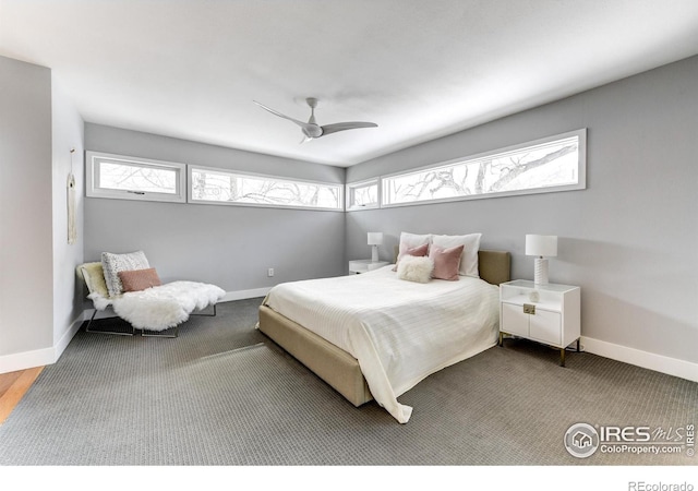 bedroom featuring multiple windows and baseboards