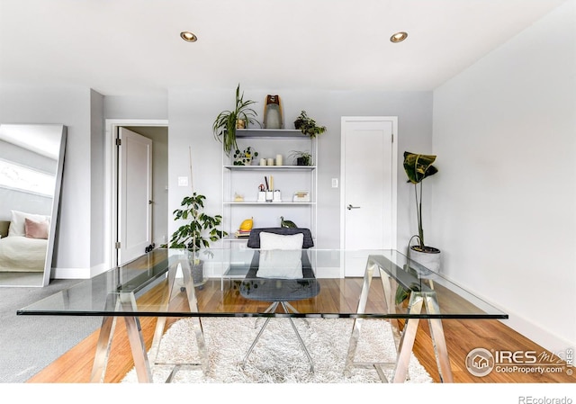 office space with recessed lighting, baseboards, and wood finished floors