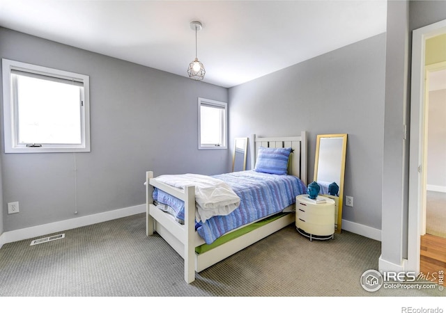 bedroom featuring visible vents, carpet, and baseboards