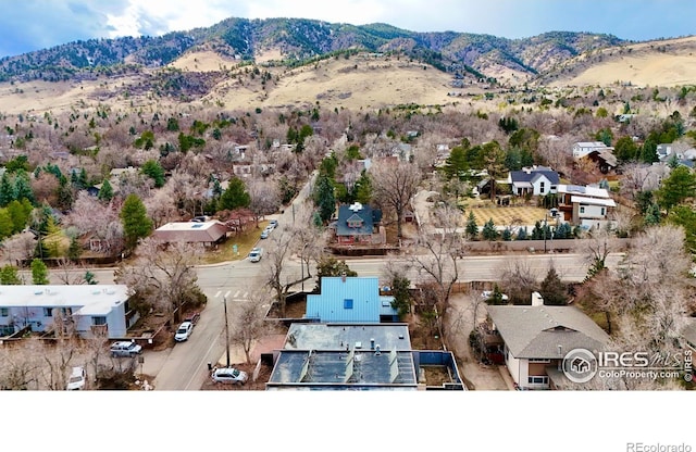 birds eye view of property with a mountain view