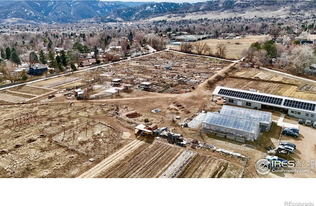 birds eye view of property with a mountain view