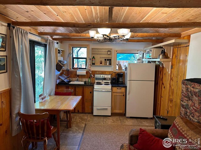 kitchen with white appliances, wooden ceiling, beam ceiling, and an inviting chandelier