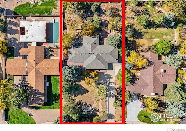 birds eye view of property with a residential view